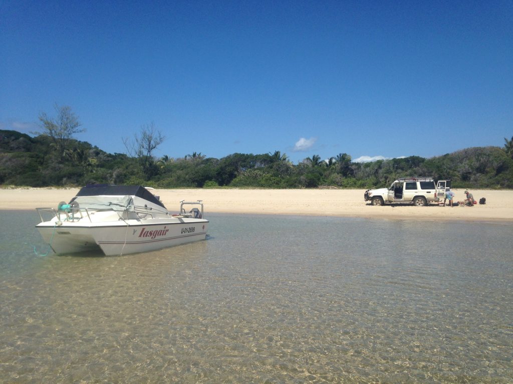 Pomene by sea: the natural sand harbour at the top of the point. Kayaks abound here.