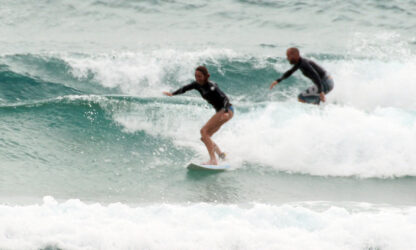 Surfing Tofo shorebreak: Team Mom and Dad Plomaritis leave a few for the kids