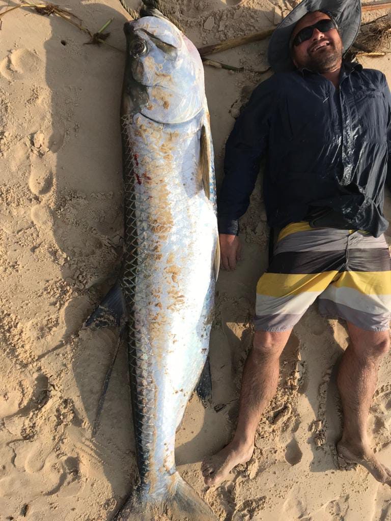 The Tarpon of Angola: here Marc sizes up the one he finally caught, after many years of trying. Worth every cast!