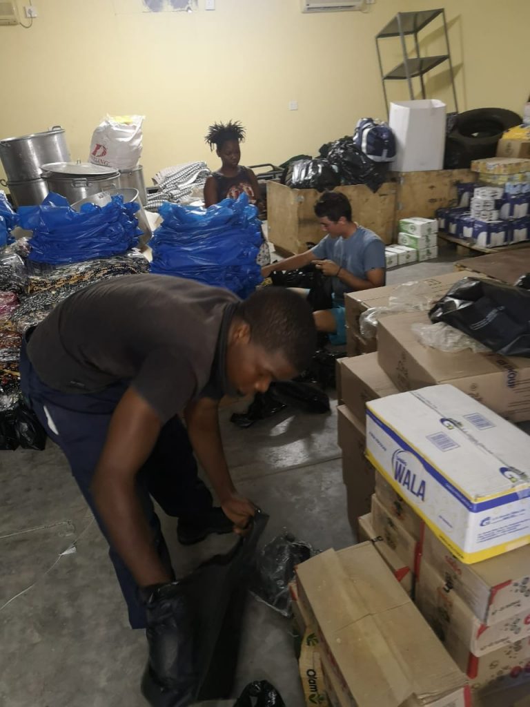 Cyclone Idai relief volunteer workers packing both inside and outside at Triton Express