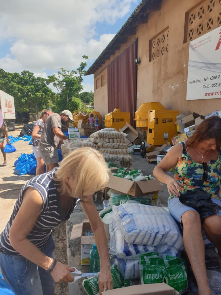 Cyclone iDai relief volunteers in Vilankulos packing aid supplies at Triton Express